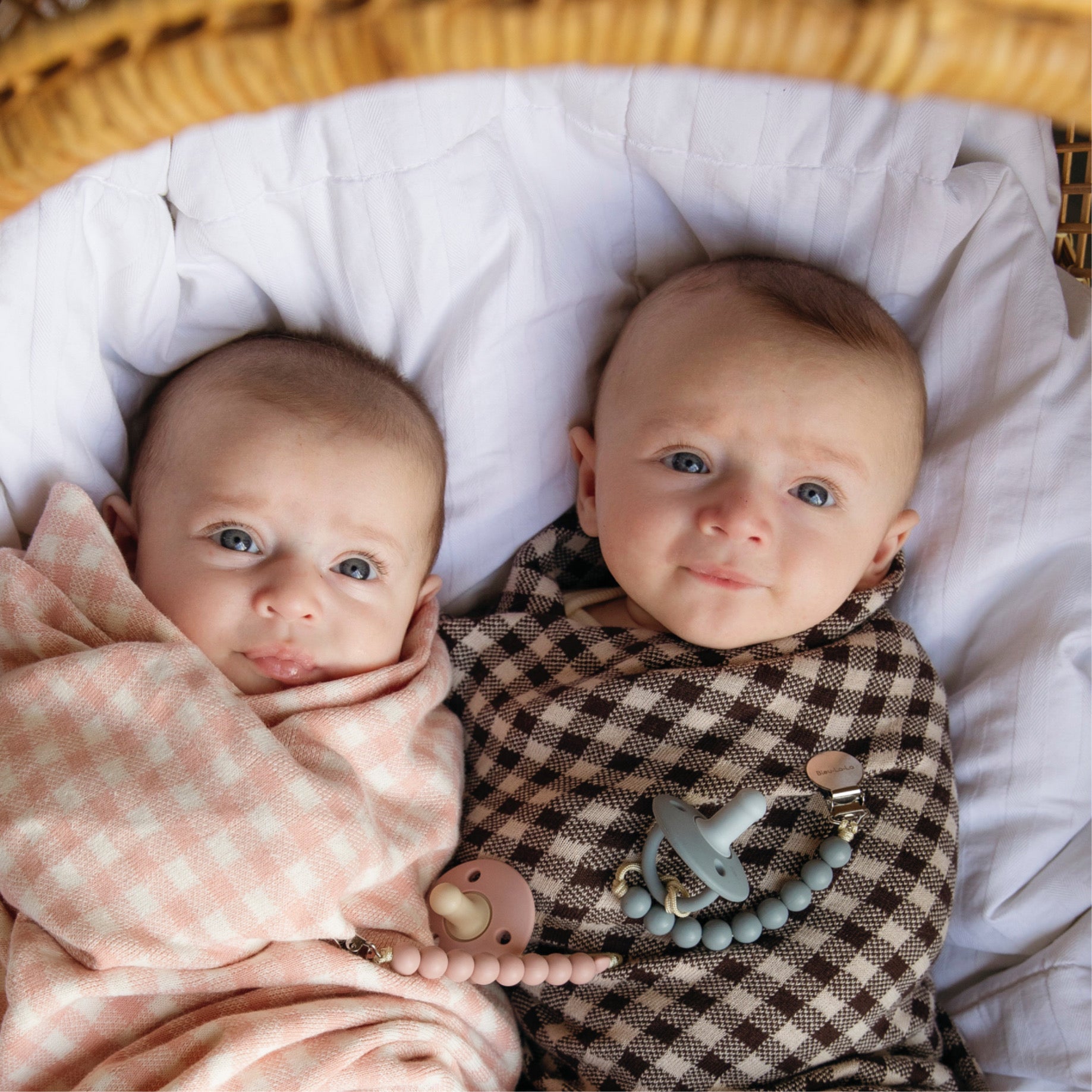Bleu Lo Lo two babies wrapped in cozy checkered knit blanket for comfort and warmth