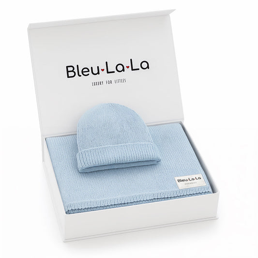 Blue baby hat and blanket set in a box with Bleu La La branding. Luxe Collection organic cotton baby blanket and matching hat set in premium gift box.