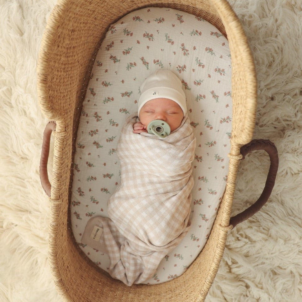 Checkered knit baby blanket available in multiple colors including rose, brown, camel and gray