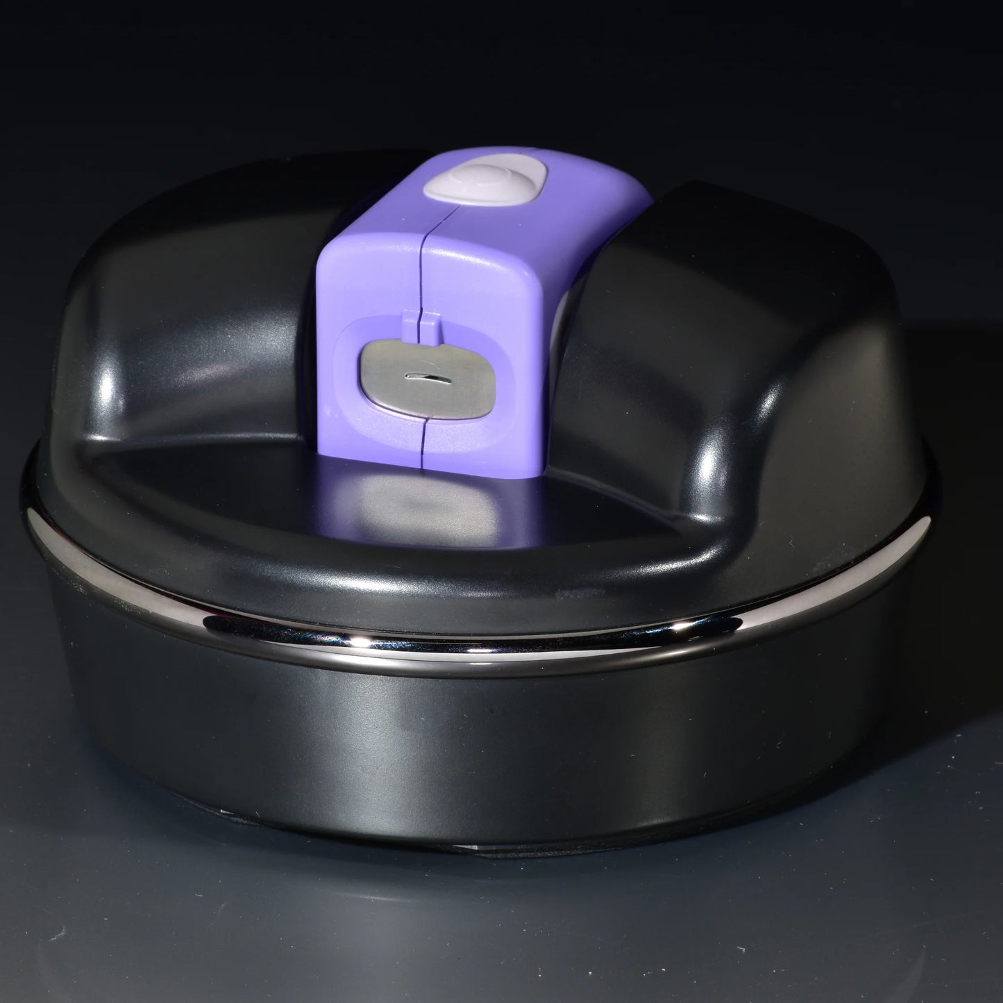 Purple toddler Lil Nipper electric nail clipper inserted in The POD adaptive base for a safe and easy one-handed operation. Perfect for Lucky Fin and limb difference.