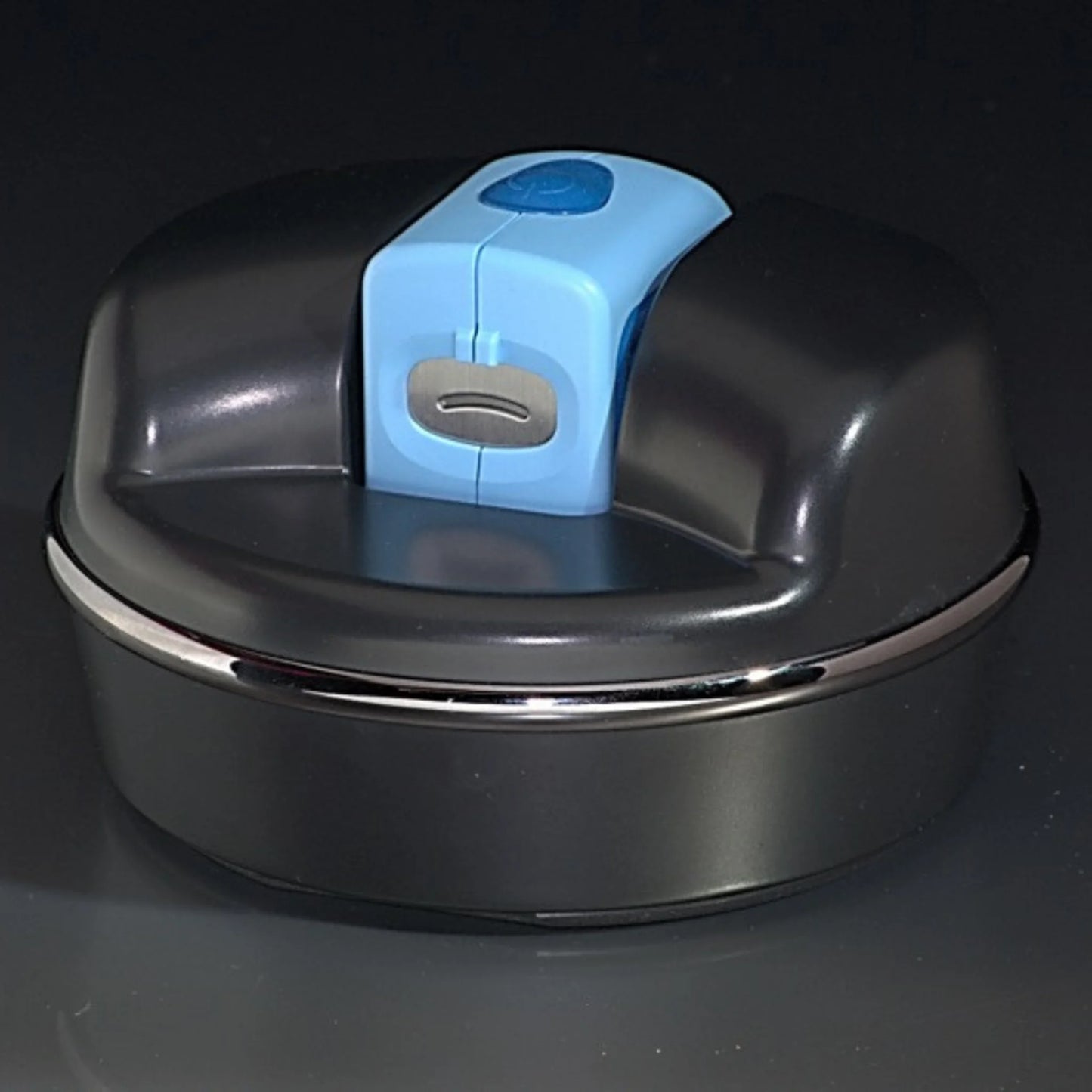 Blue adult Lil Nipper electric nail clipper inserted in The POD adaptive base for a safe and easy one-handed operation.