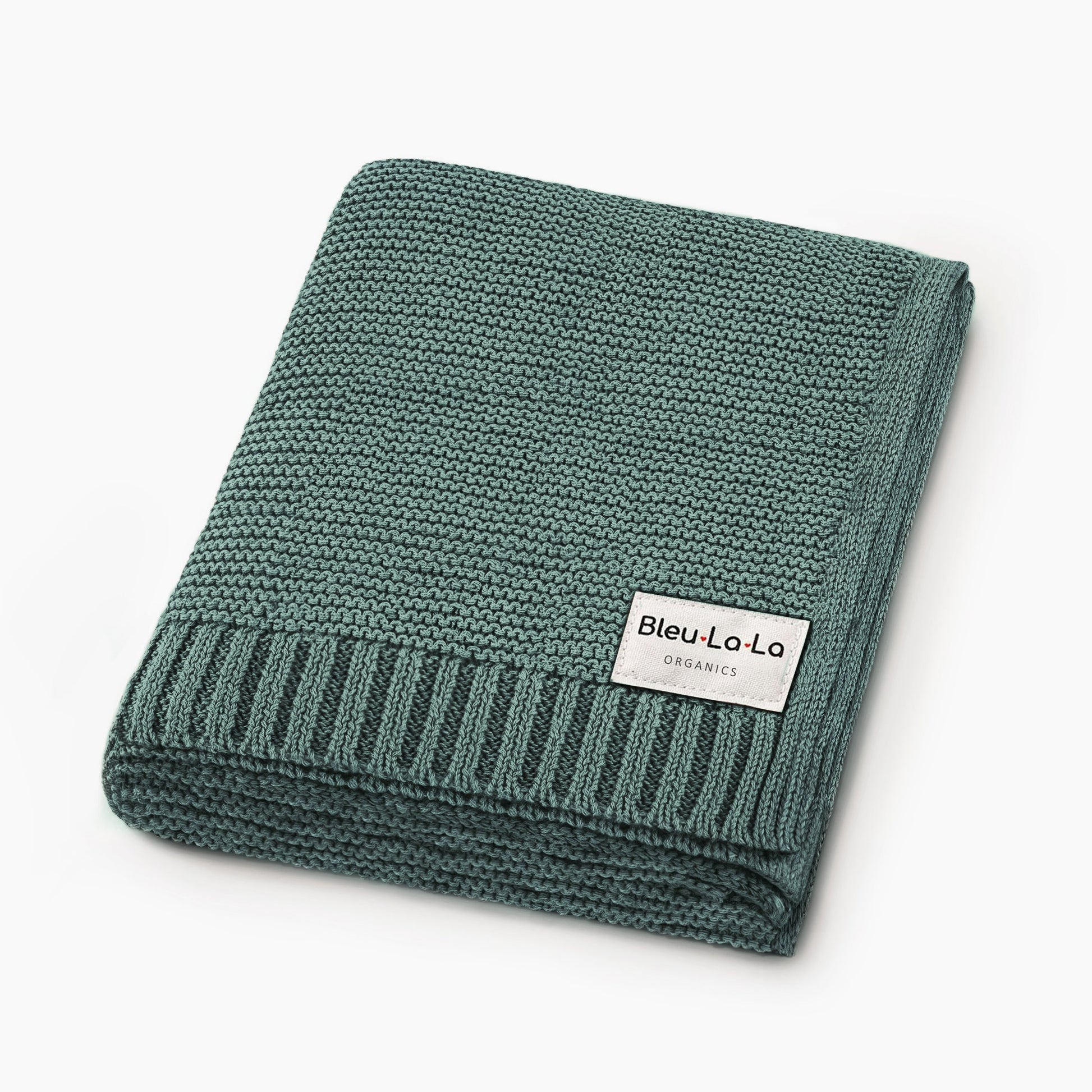 Folded green knit blanket with a visible Blue-La-La label on a white background