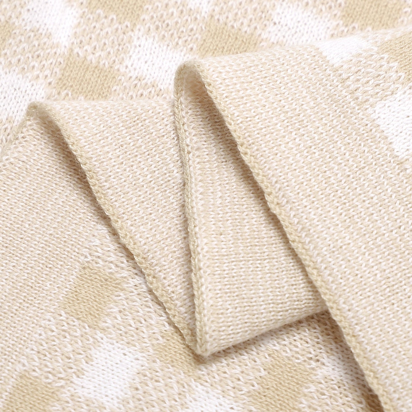 Close-up of beige fabric with a subtle pattern