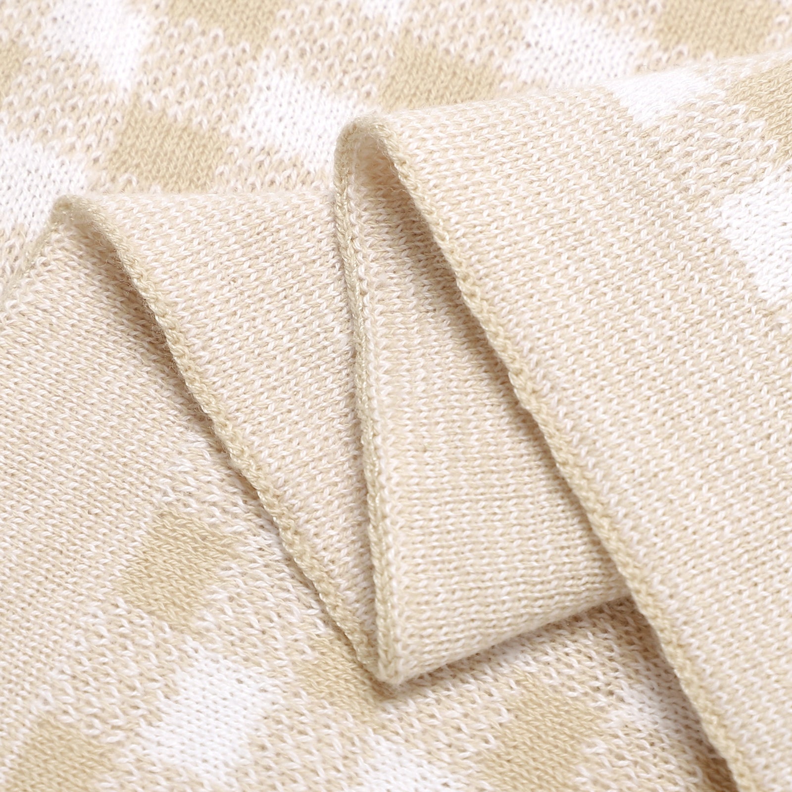 Close-up of beige fabric with a subtle pattern