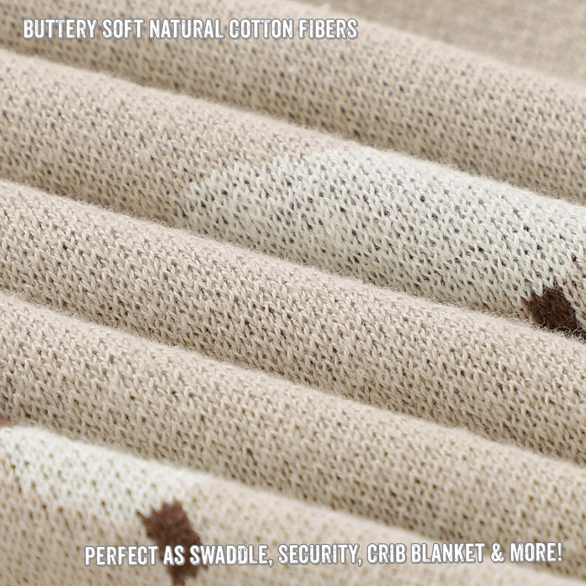 Close-up of beige swaddle blanket with text about soft natural cotton fibers.