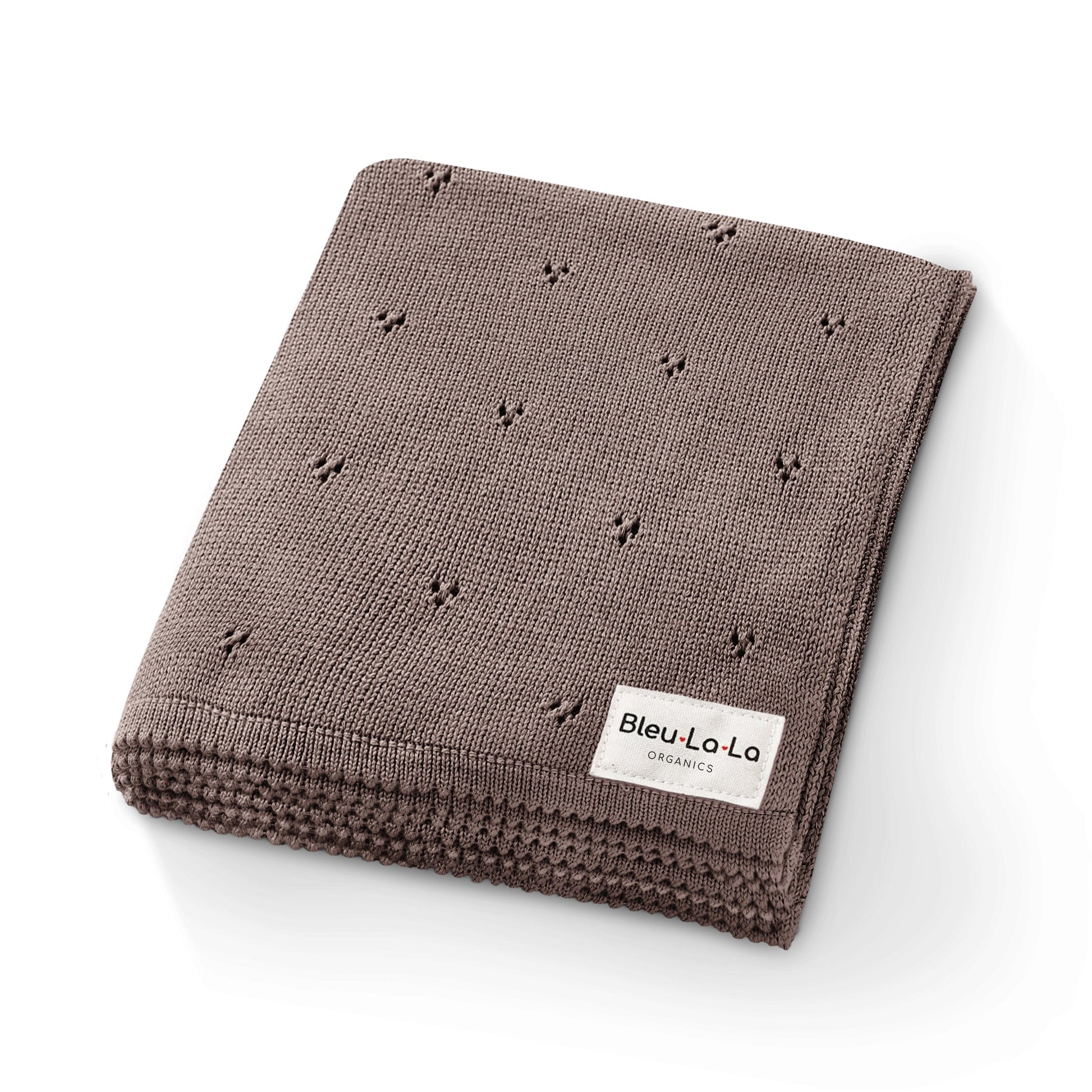 Brown 'Bleu La La'  knitted blanket with small patterns and a visible brand label on a white background