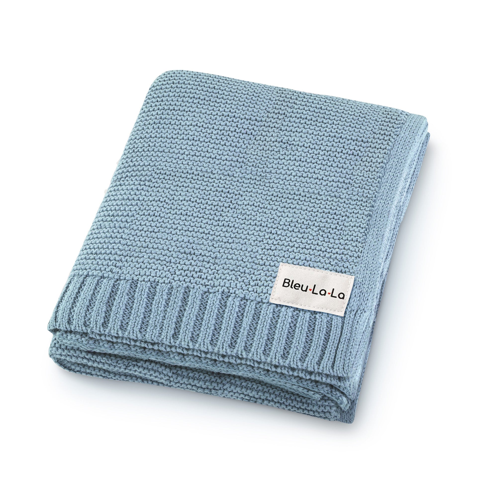Folded blue knit blanket with a visible Blue-La-La label on a white background