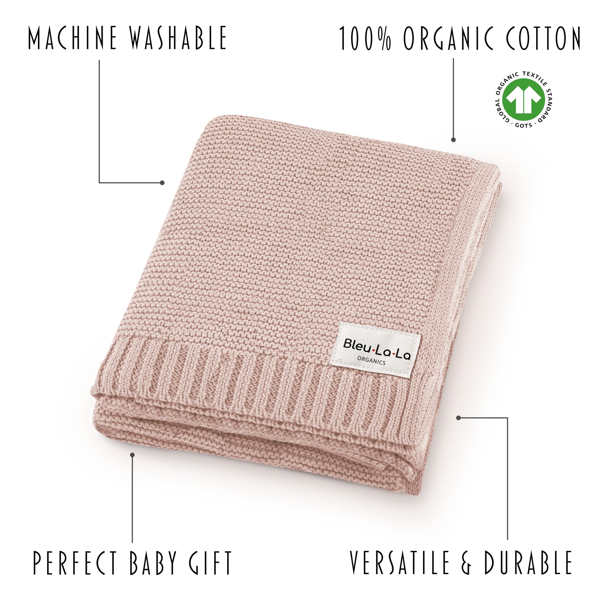 Folded pink blanket with Bleu La La label on a white background, featuring text about machine washability and organic cotton.