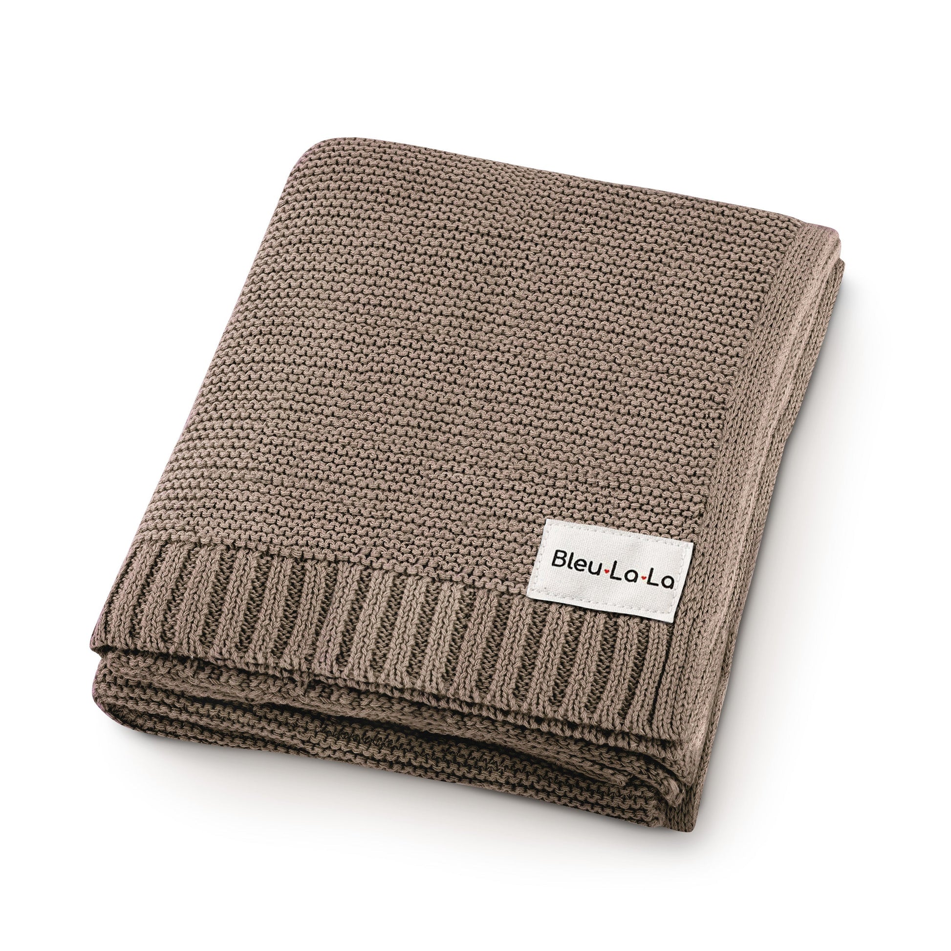 Folded brown knit blanket with a visible Blue-La-La label on a white background