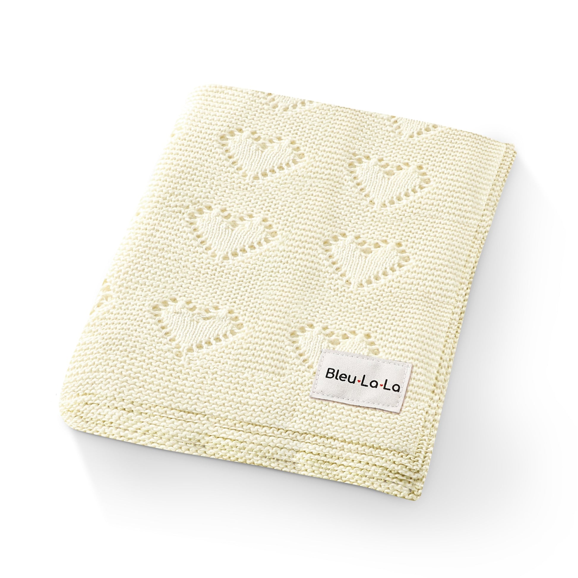 Knitted blanket with heart patterns and a visible Bleu-la-la  label on a white background