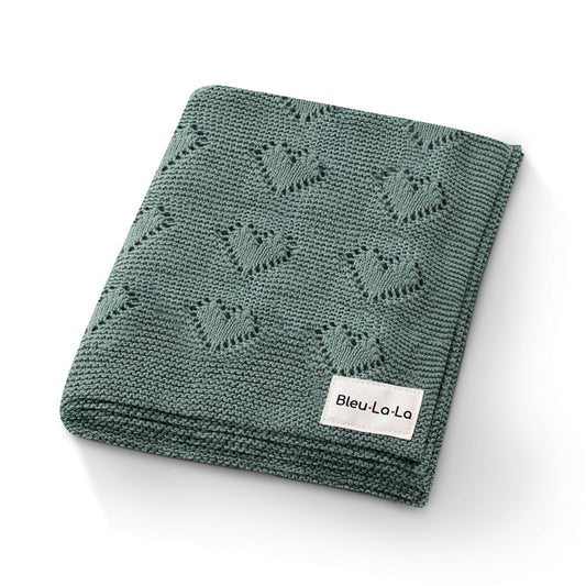 Green knitted blanket with a pattern and 'Bleu La La' label on a white background