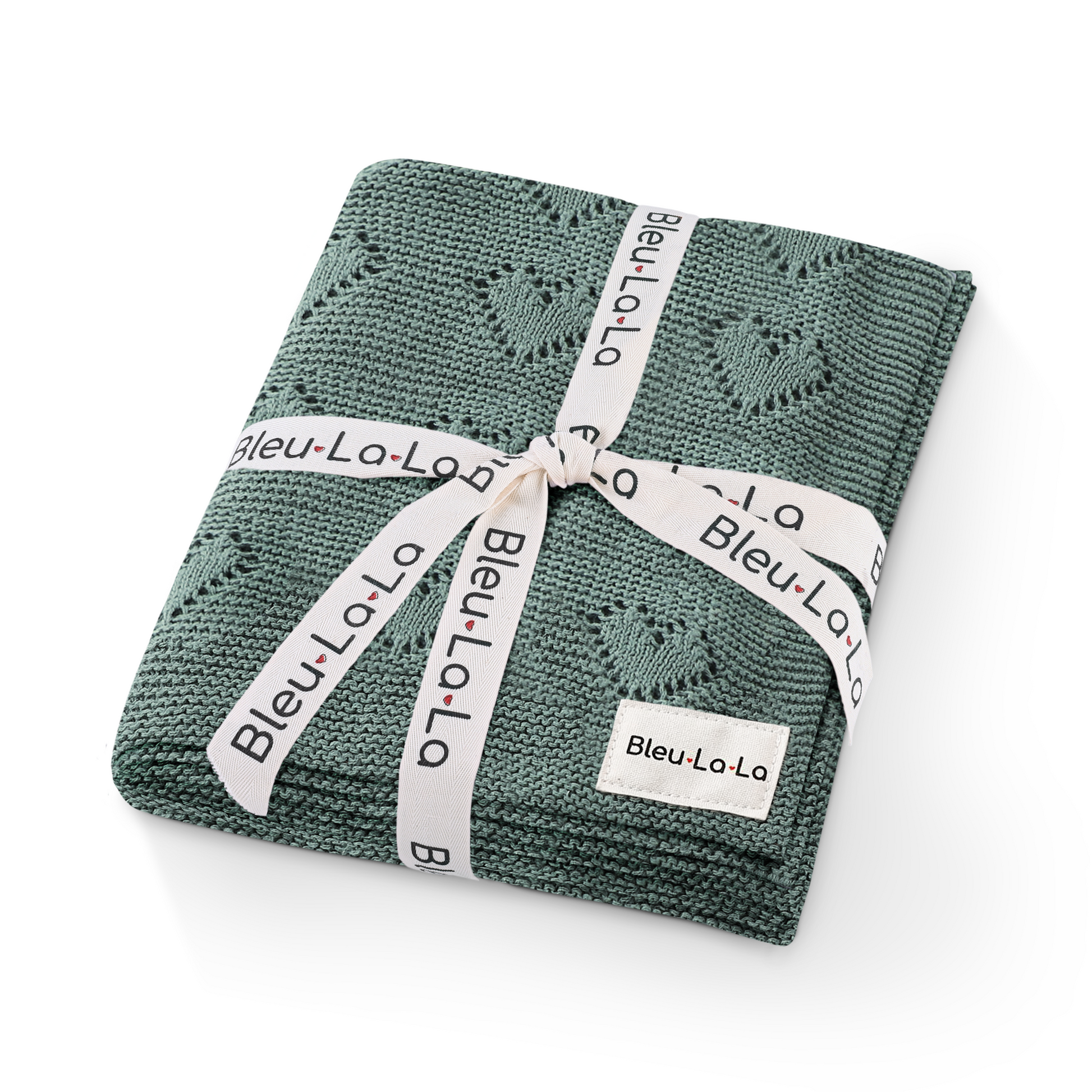 Green knitted blanket with a white ribbon and 'Bleu La La' label on a white background