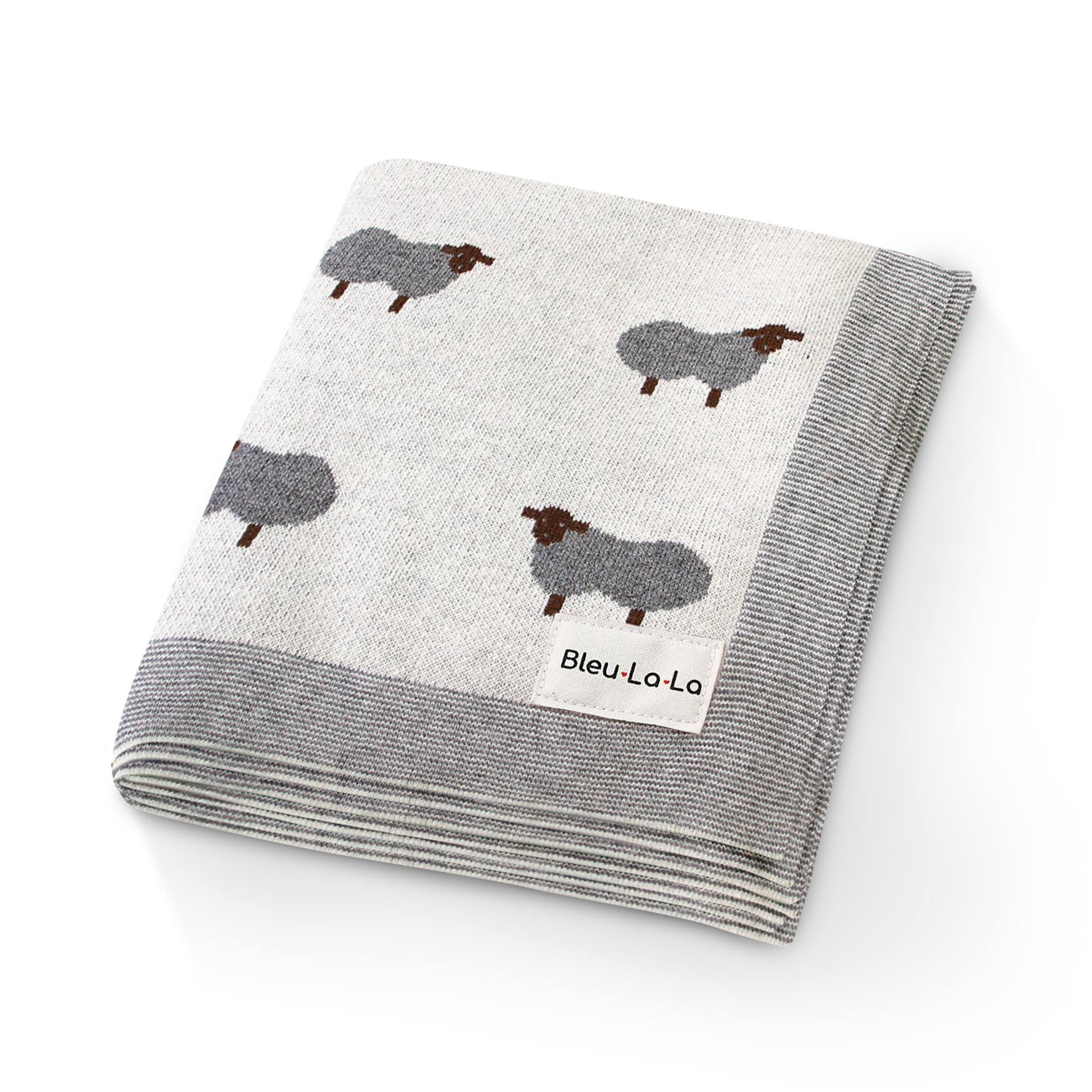 Folded blanket with sheep pattern and 'Bleu Lo La' label on a white background