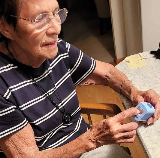 Gloria (80) clipping her nails comfortably with the adult sized Lil Nipper.