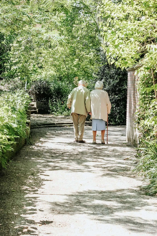 Two seniors walking together.