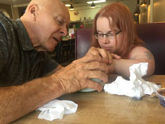 Tom demonstrating the ClipDifferent Pro for a woman with a disability
