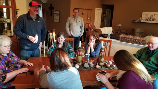 Family gathering at dining room table using the Pro electric nail clipper