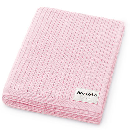 Pink ribbed blanket with Bleu-La-La label on a white background