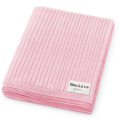 Pink ribbed blanket with Bleu-La-La label on a white background