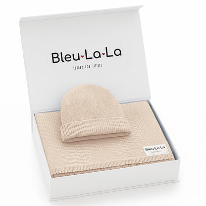 Beige baby hat and blanket set in a 'Bleu La La' box on a white background