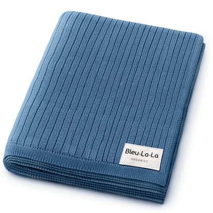 Folded blue knit blanket with Bleu-La-La label on a white background