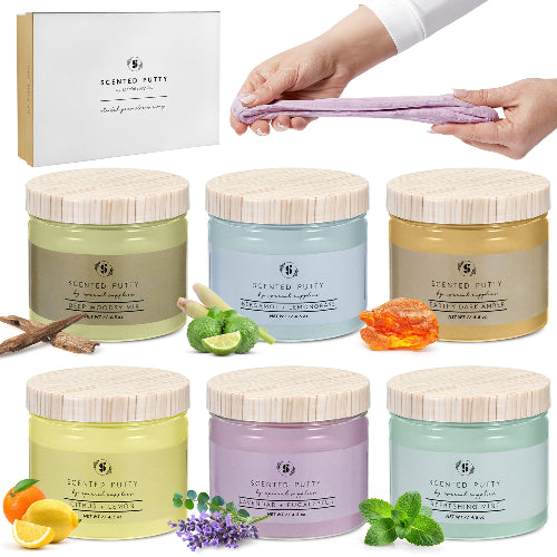 Set of scented putty jars with decorative elements and a hand holding a towel.