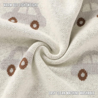 Close-up of fabric with brown circular patterns on a beige background, labeled 'Warm but Lightweight' and 'Easy clean machine washable'.