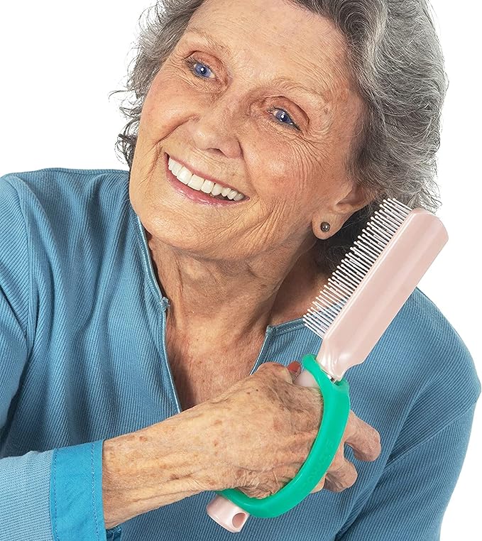 Woman holding a hair comb with a EaZyHold grip handle on a white background