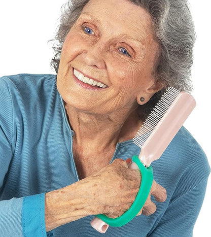 Woman holding a hair comb with a EaZyHold grip handle on a white background