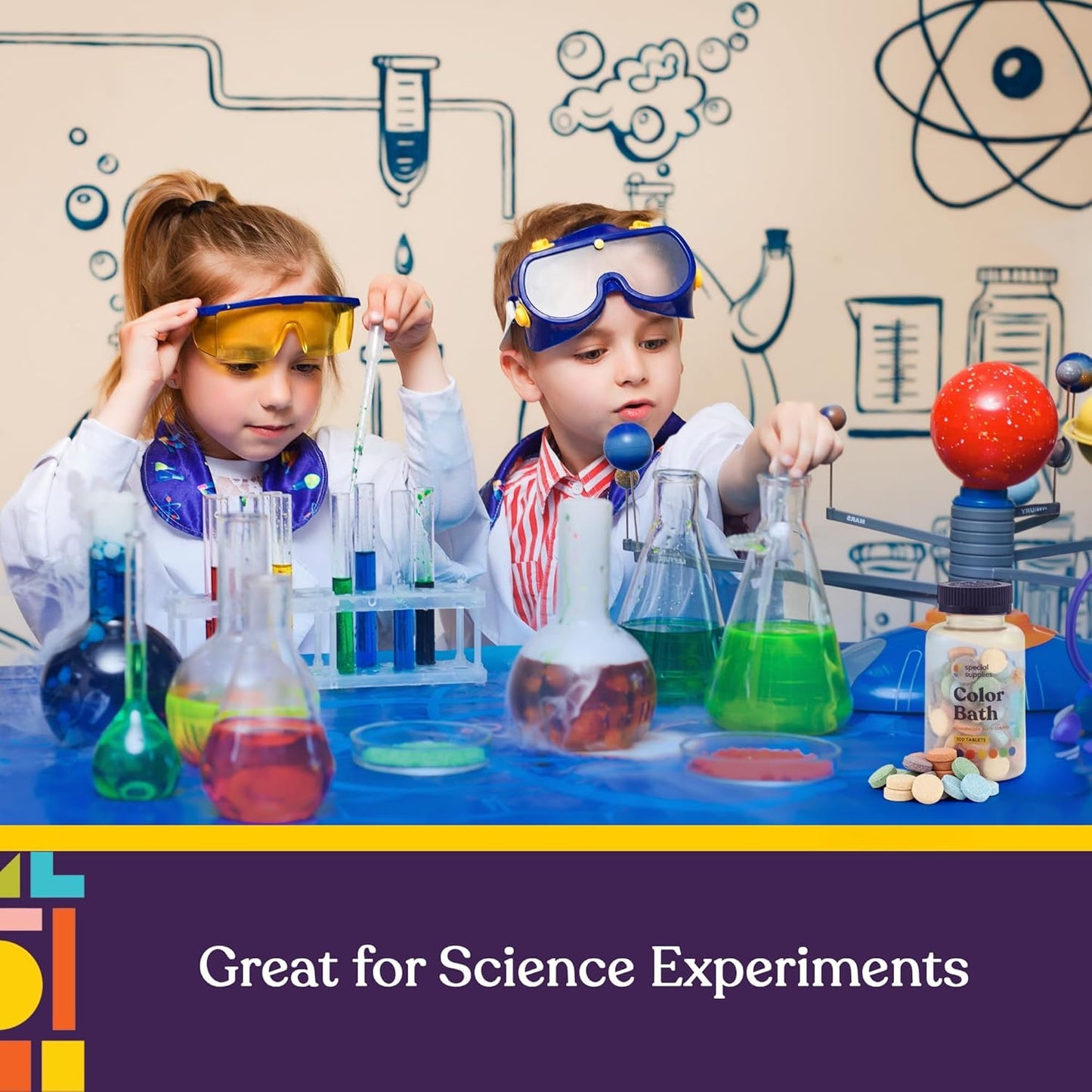 Two children in lab coats and goggles are conducting science experiments with Special Supplies Color Bath Tablets.