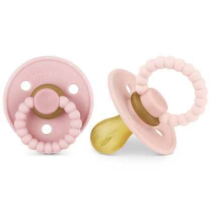 Two pink Luladream pacifier with a teething ring on a white background