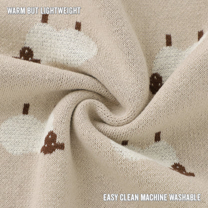 Close-up of beige fabric with brown patterns, labeled 'Warm but Lightweight' and 'Easy clean machine washable'.