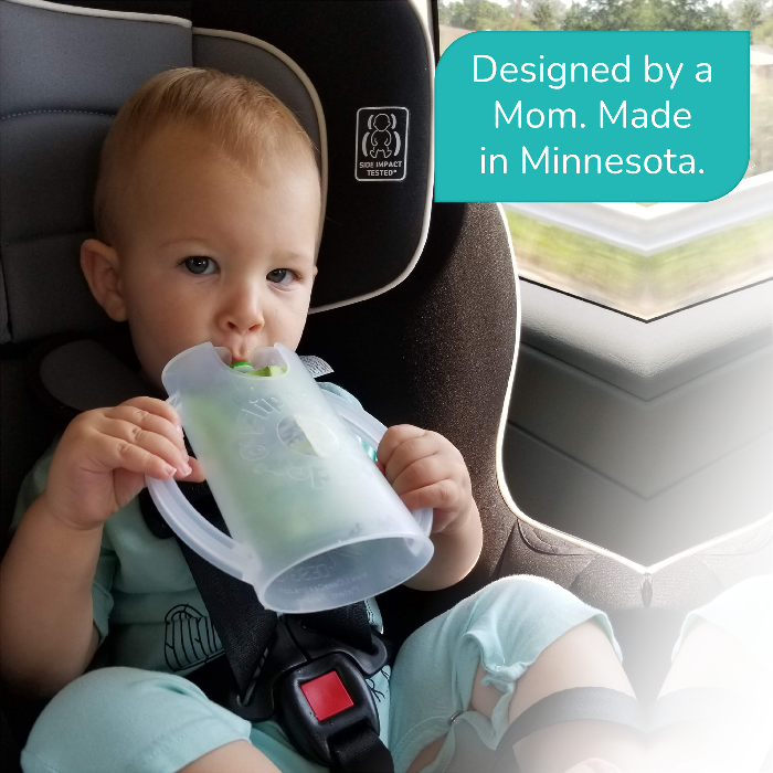 Baby in a car seat drinking from a cup with text 'Designed by a Mom. Made in Minnesota.'