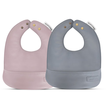 Two baby bibs, one pink and one gray, on a white background.