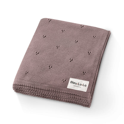 Folded brown blanket with a 'Bleu La La' label on a white background