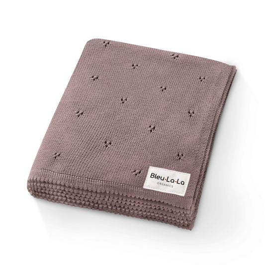 Folded brown blanket with a 'Bleu La La' label on a white background