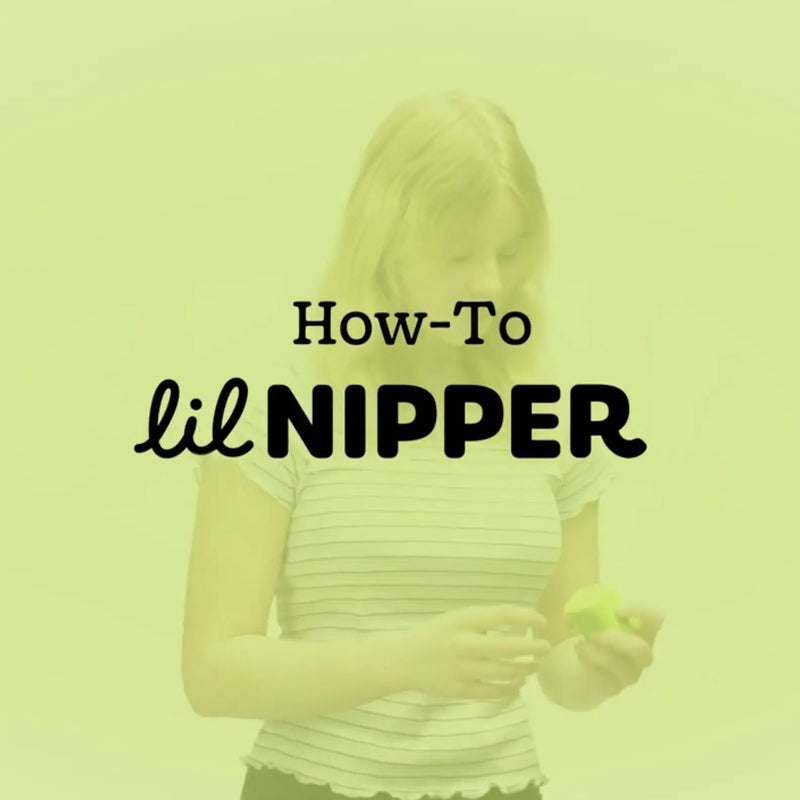 Young girl independently using Lil Nipper electric nail clipper - safe kids nail trimmer how-to guide. How-To Lil Nipper overlay.