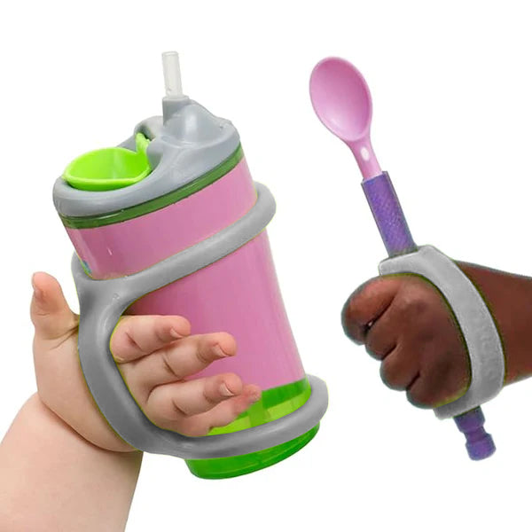 Child holding a pink sippy cup and purple spoon with platinum EaZyHold grips on a white background.