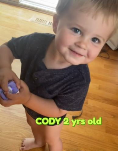 2 year old adorable boy dancing and clipping his nails using a purple Lil Nipper