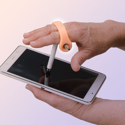 Hand holding a smartphone with a stylus and a small tool on a white background