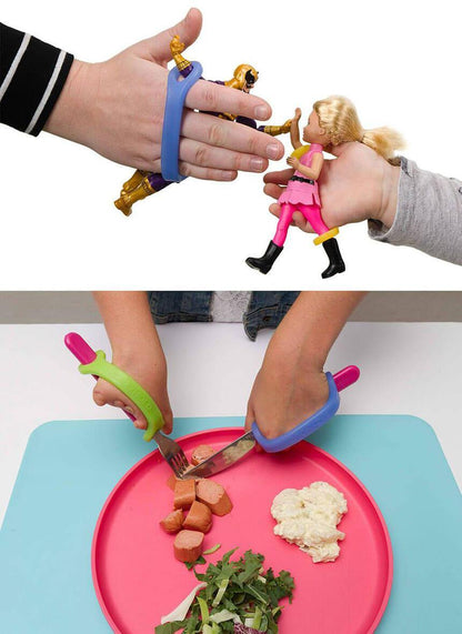 Children's toys, utensils, dolls and a plate of food with hands using EazyHold grip tools.