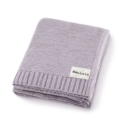 Folded gray knit blanket with 'Bleu-La-La' label on a white background