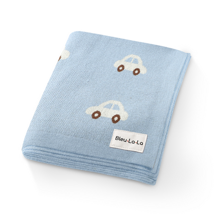 Blue baby blanket with car patterns and Bleu La La label on a white background