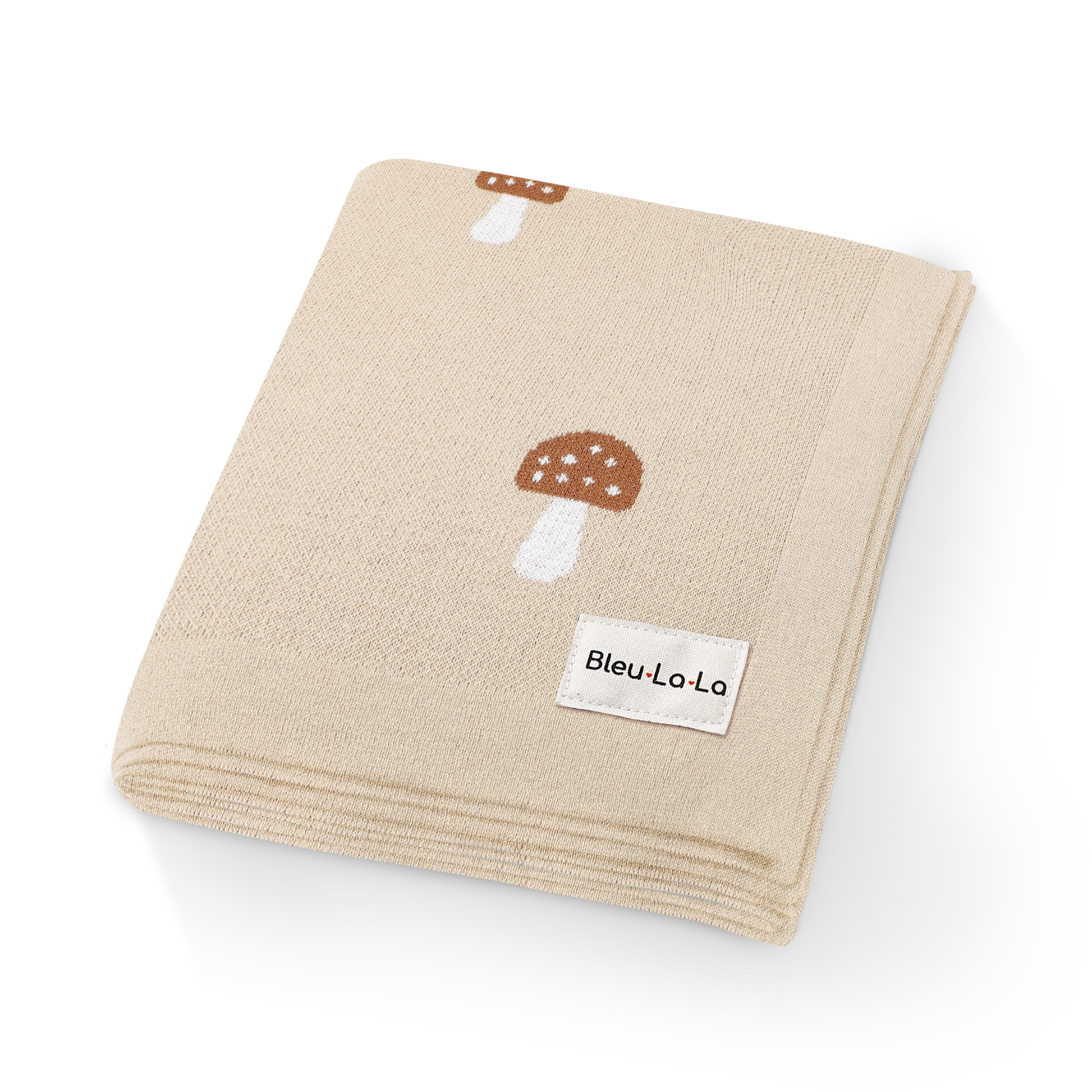 Beige towel with mushroom design and 'Bleu La La' label on a white background