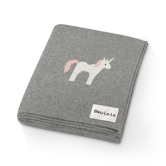 Gray blanket with unicorn design and Bleu-La-La label on a white background