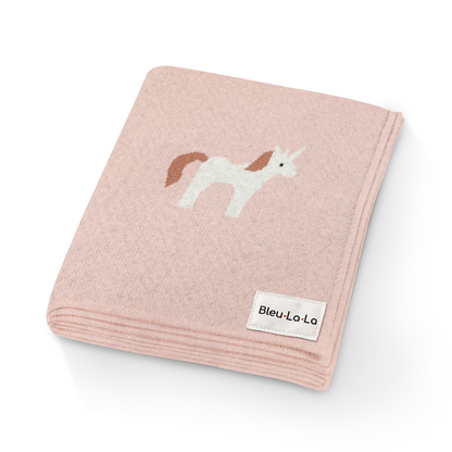 Pink blanket with unicorn design and Bleu-La-La label on a white background