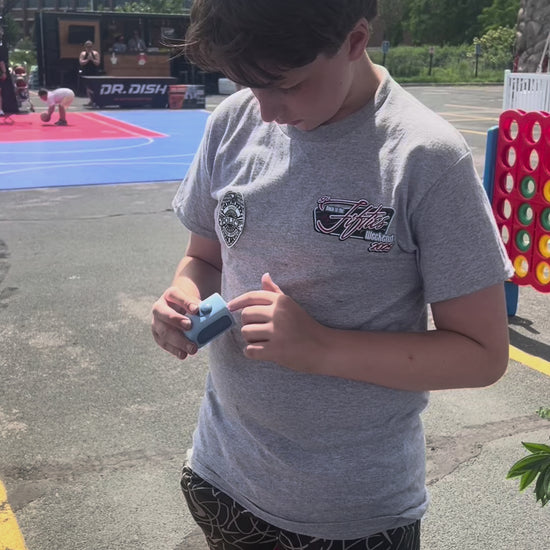A teenager smiling after using a Lil Nipper Adult size