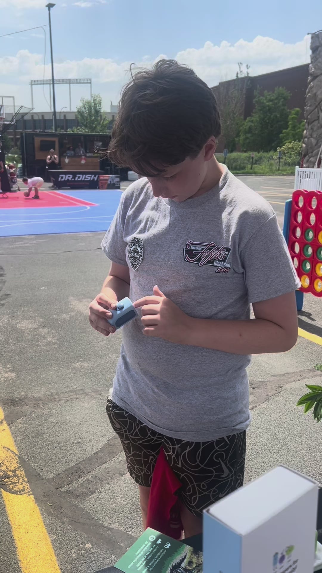 A teenager smiling after using a Lil Nipper Adult size