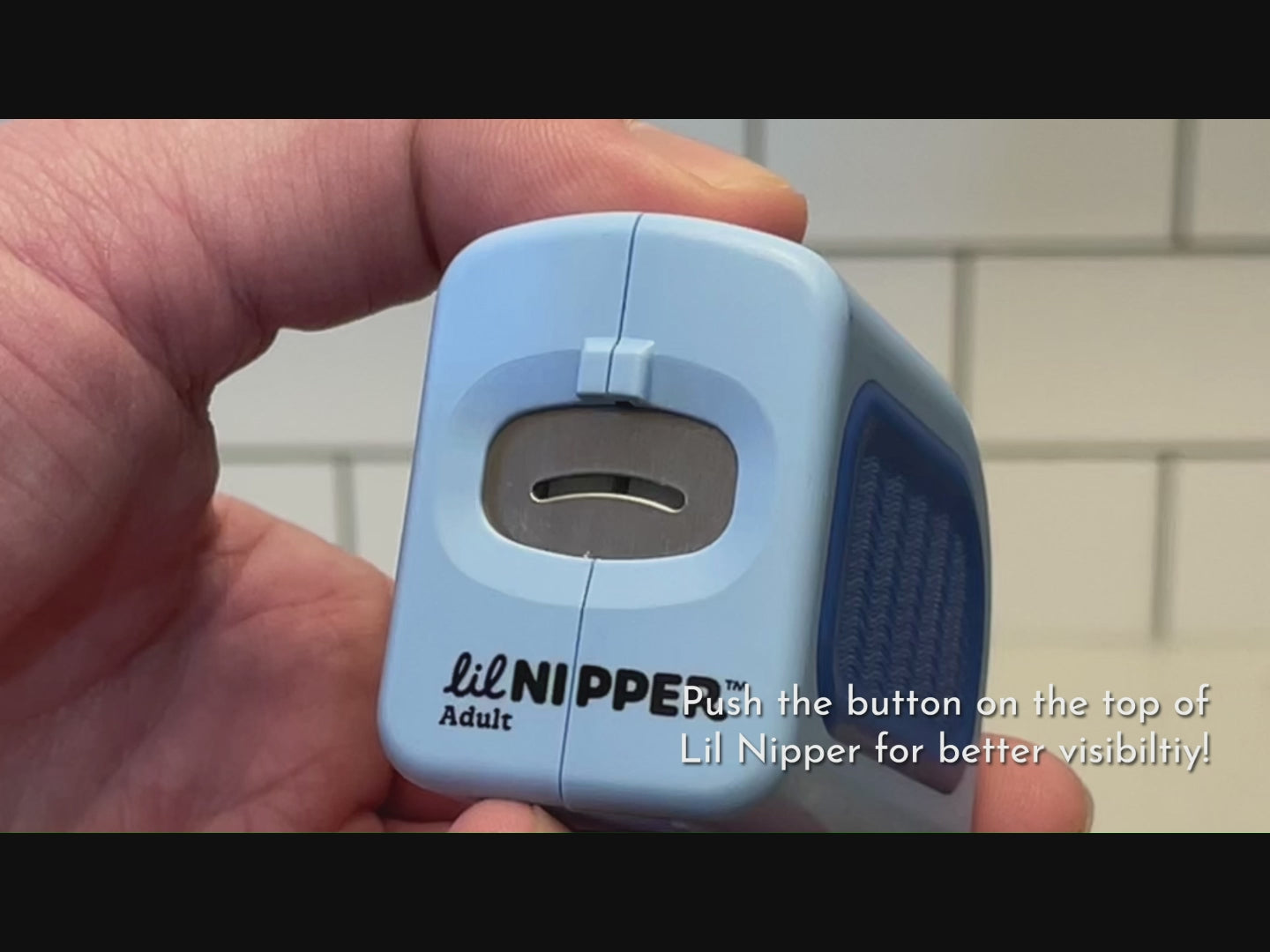 Load video: How to video showing Lil Nipper. Turn on by pushing top button. Behind the safety slot is a blade that will safely and gently take a sliver of a nail at a time. Insert your nail into this safety slot and let the device do all the work for you. Rotate finger. When completed trimming nails, turn off. Slide open bottom compartment to dispose of your nail clippings.