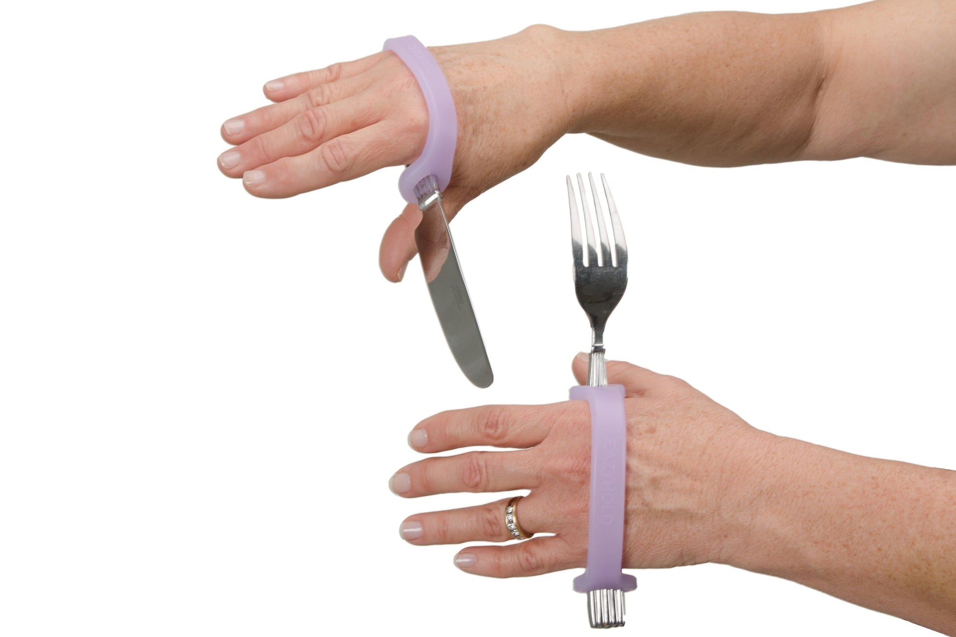 Person using a purple EazyHold grip tool to assist with holding a knife and fork.